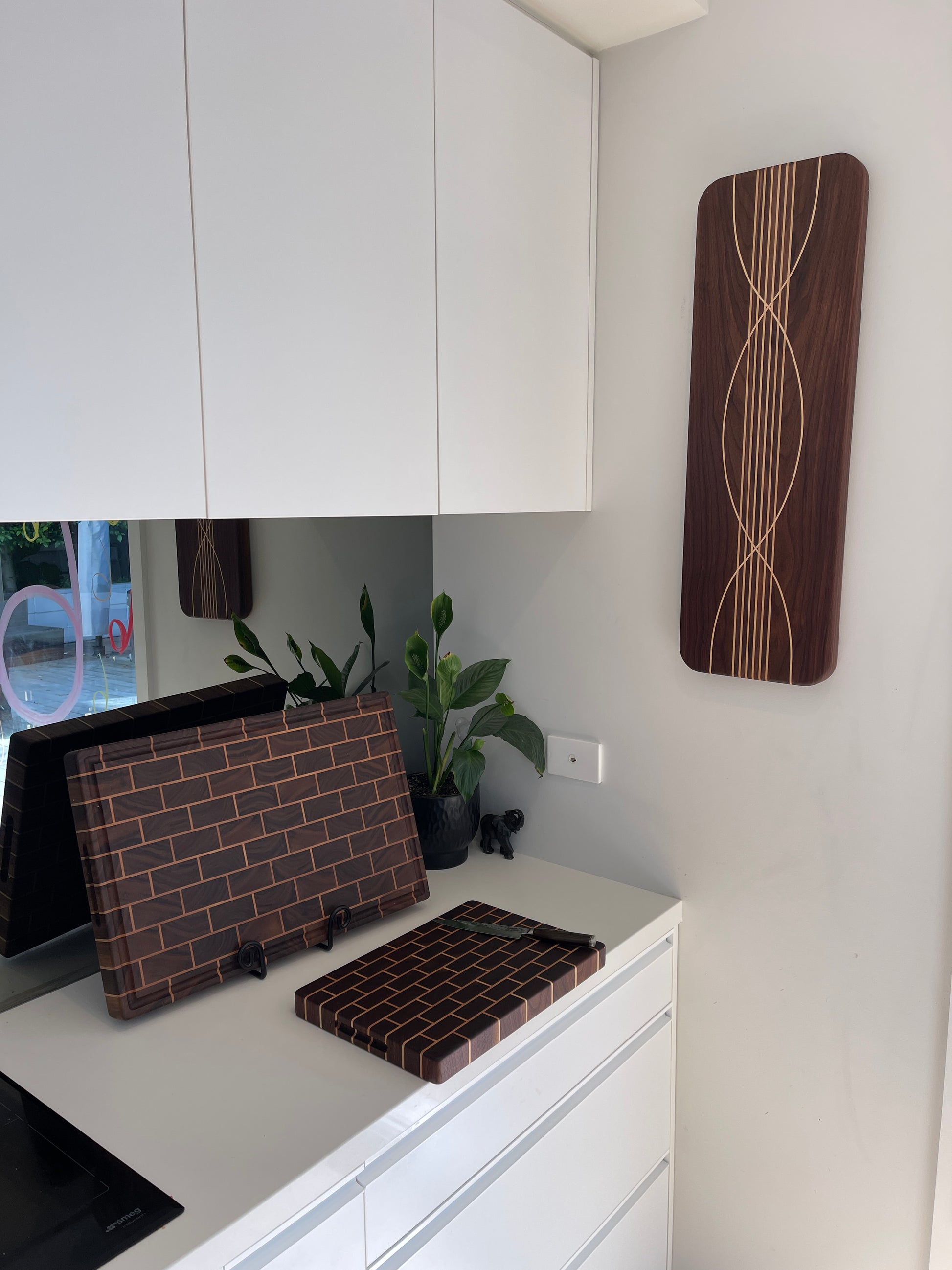 A collection of handcrafted boards, functional artisan kitchen art by TuckerCraft Auckland
