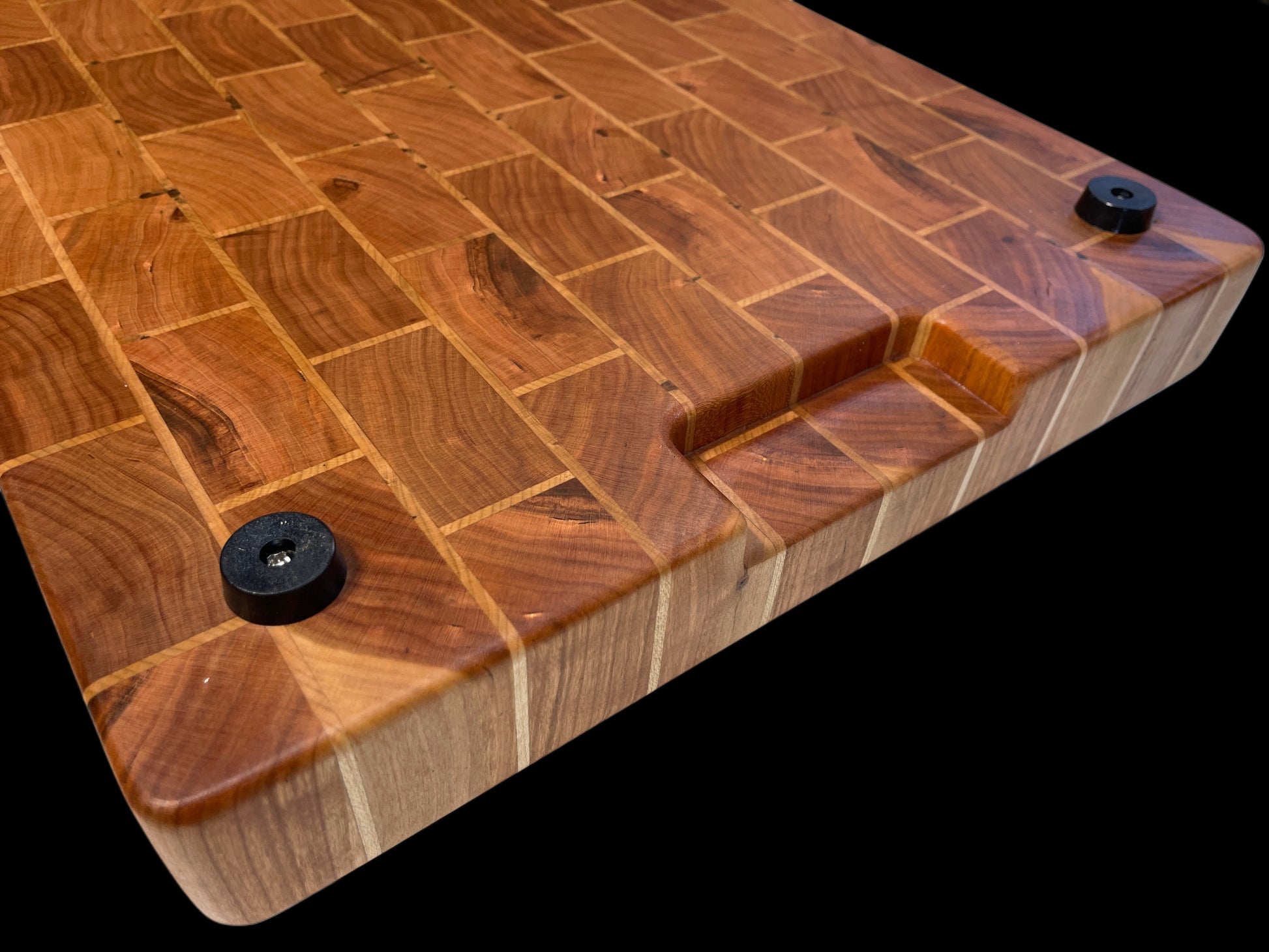 Commercial sized end-grain chopping board, handmade designer brick pattern for serious kitchens and chefs. Fitted with rubber feet and recessed holds for heavy duty use. Made from premium hardwoods Cherry & Maple it's built to last a lifetime. also premium Gifting for serious cooks.