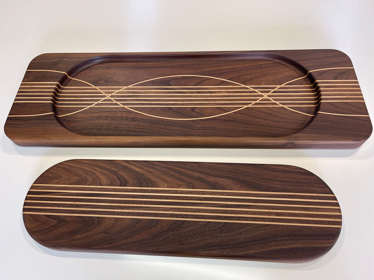 Handcrafted in Auckland New Zealand from Premium timbers Walnut and Maple , these unique boards are a 2 board set held together with magnets. blending functionality with wall art and entertaining charcuterie board. great for gifting at weddings, housewarmings, for him or for her gifts